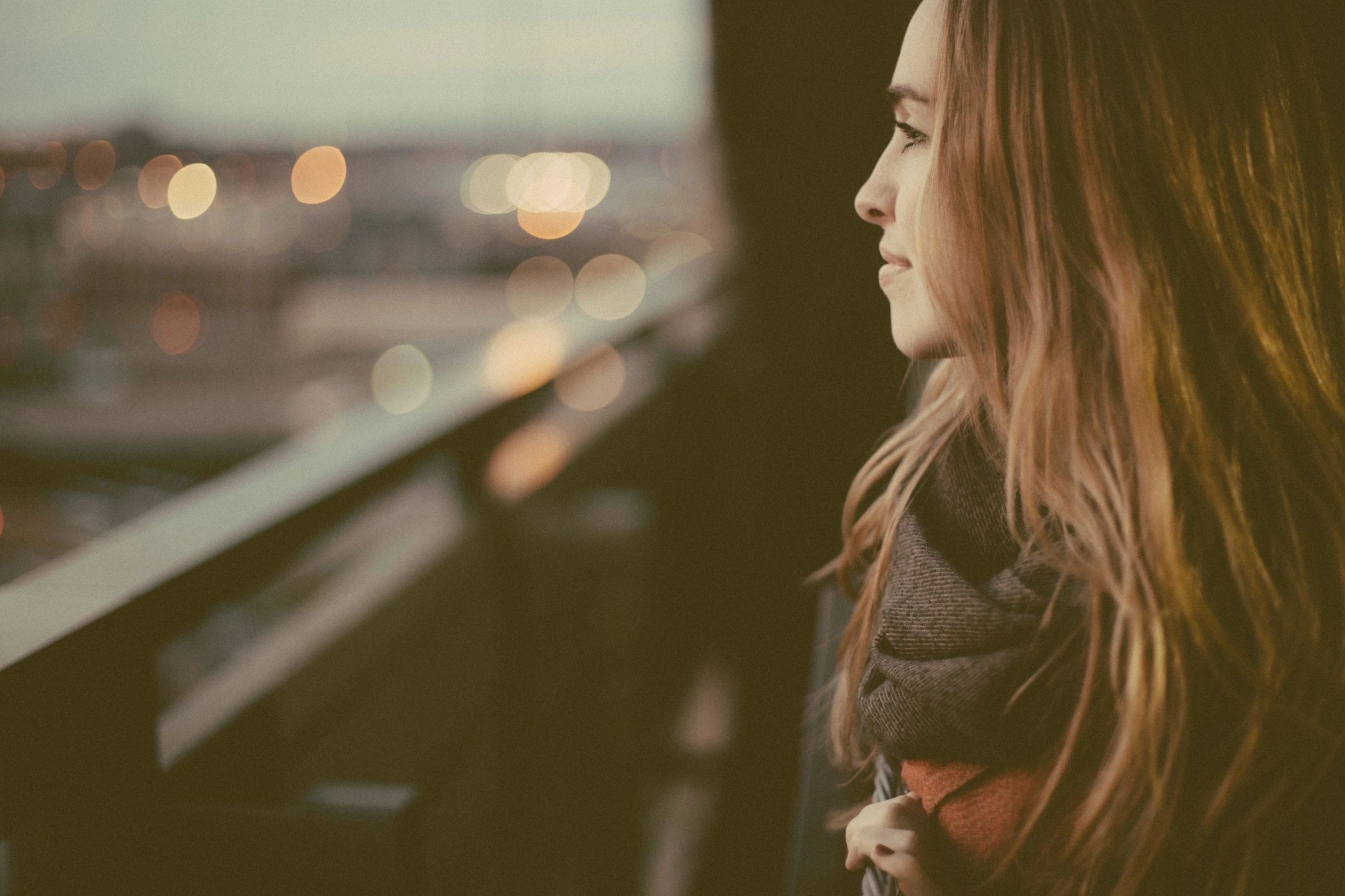 woman looking at window